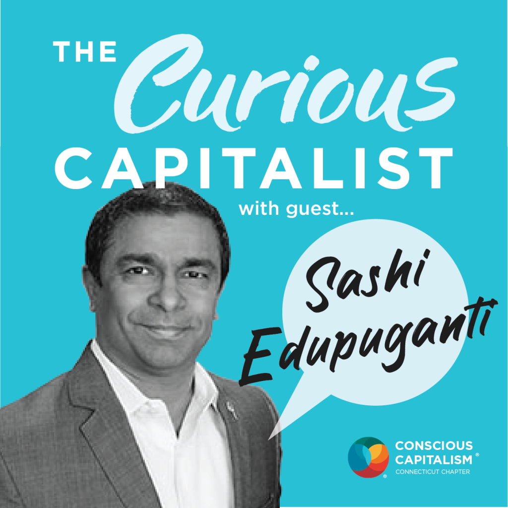 The Curious Capitalist podcast cover with Sashi Edupuganti. Sashi in an indian man wearing a suit